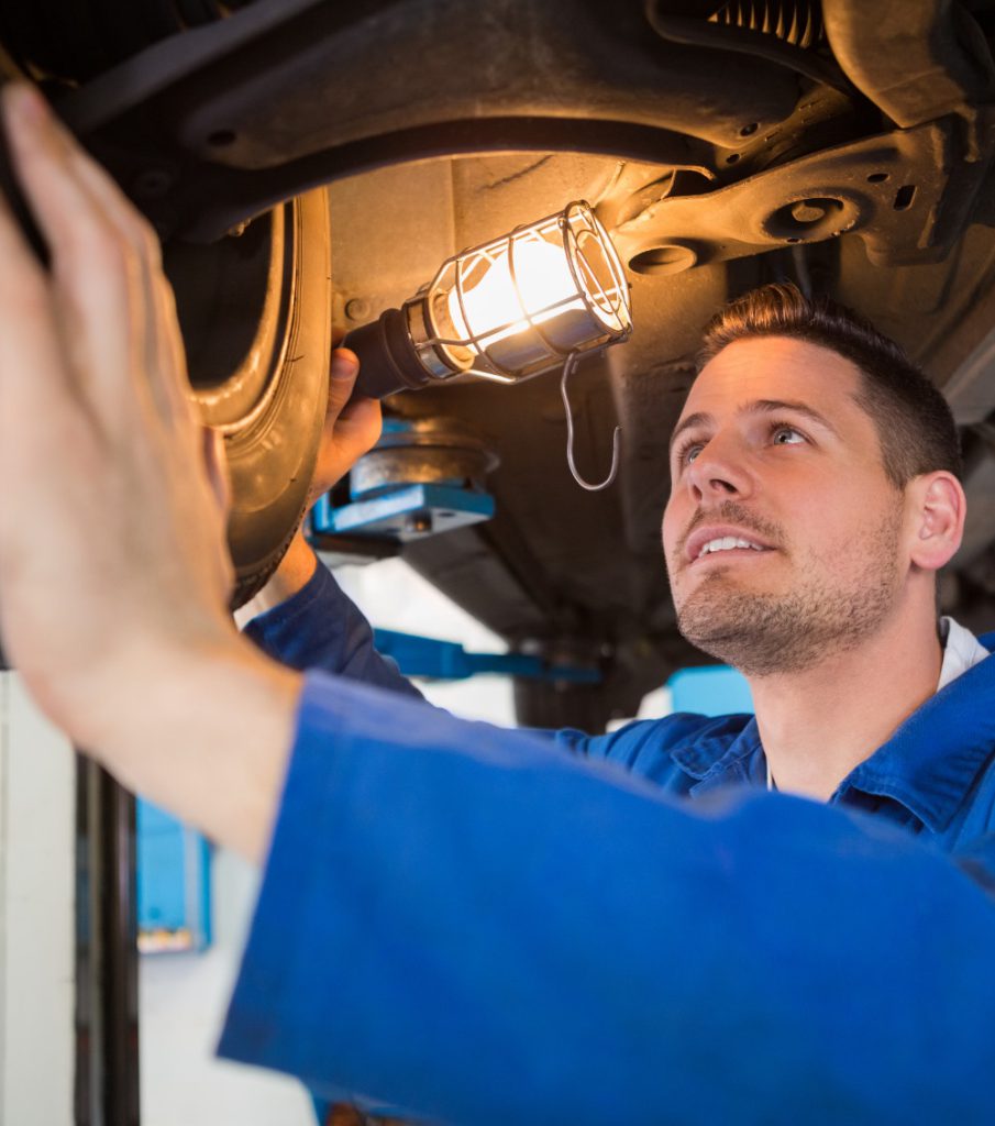 Mechanic underneath a vehicle inspecting it during the MOT - Same Day MOTs in Westcliff on Sea