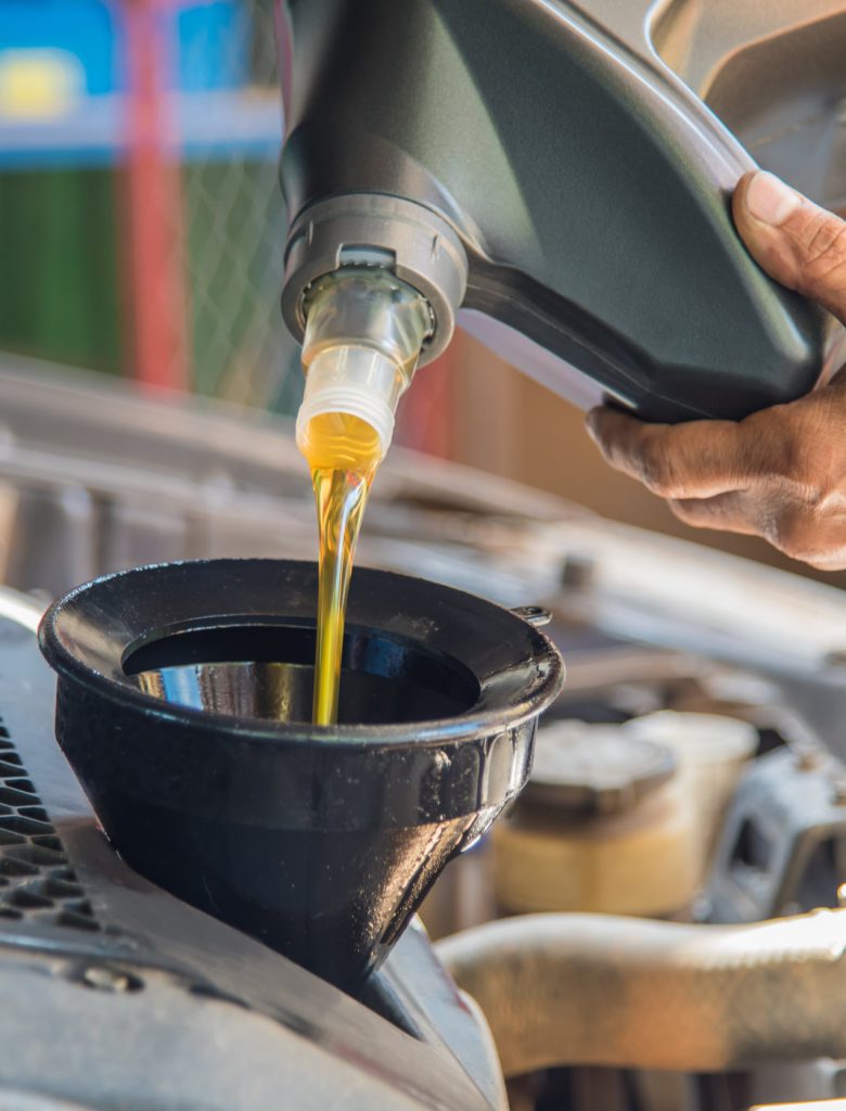 Engine oil being poured into a vehicle - Car Servicing Stockport